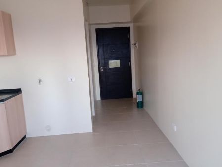 Unfurnished Studio for rent in Sola Tower 1 Vertis North  Quezon 